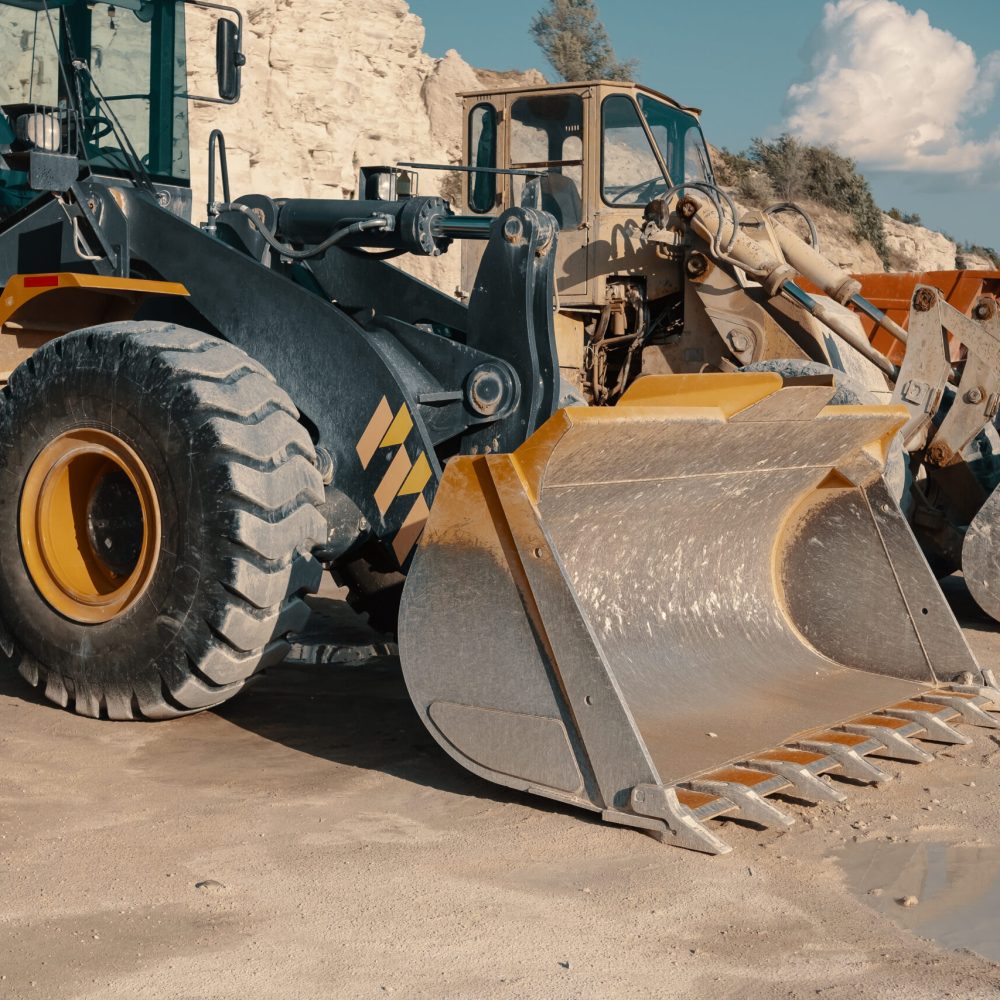 Heavy machinery in quarry. Building materials mining